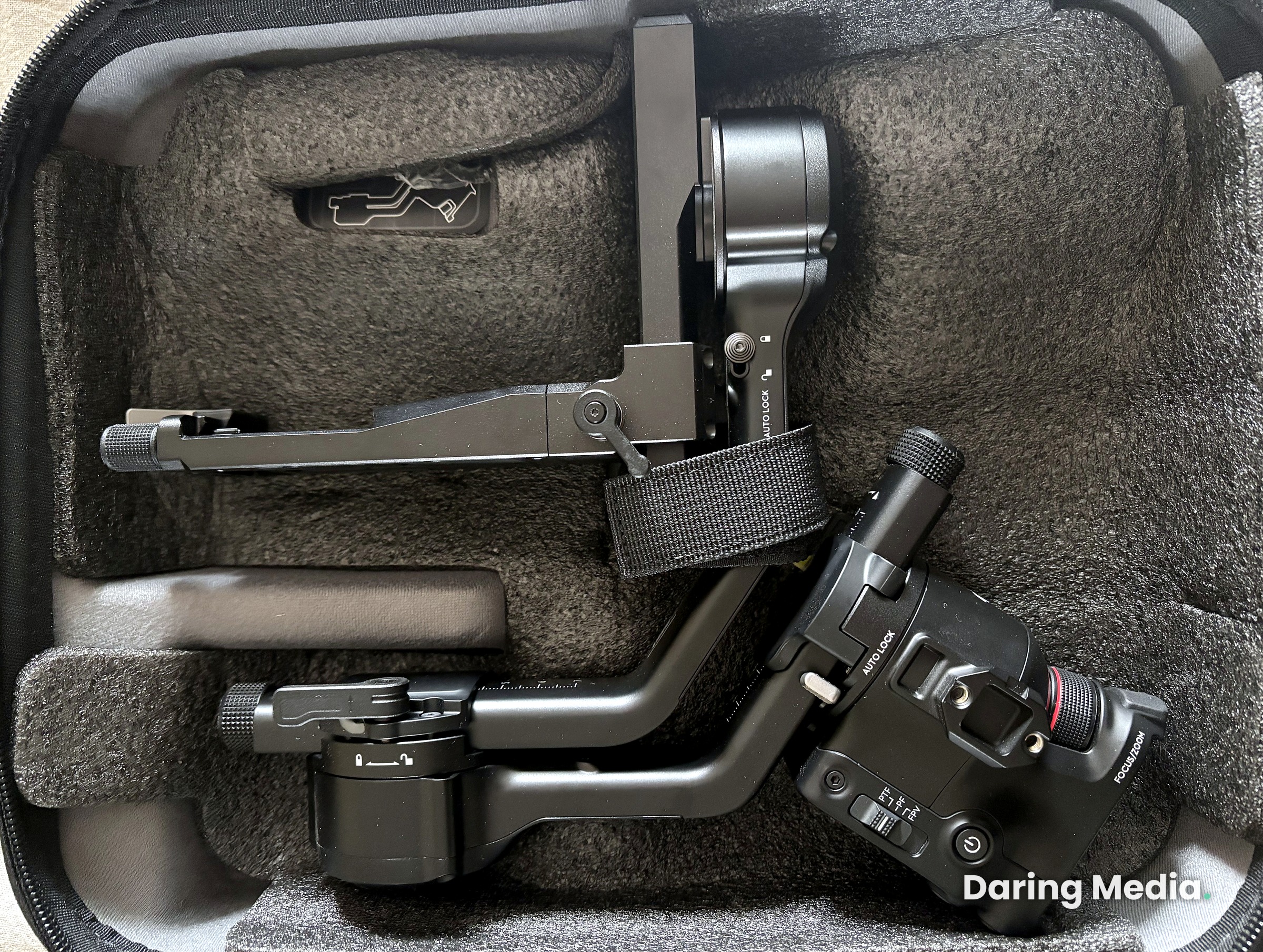 DJI RS 5 gimbal folded and packed in its custom carry case, viewed from above