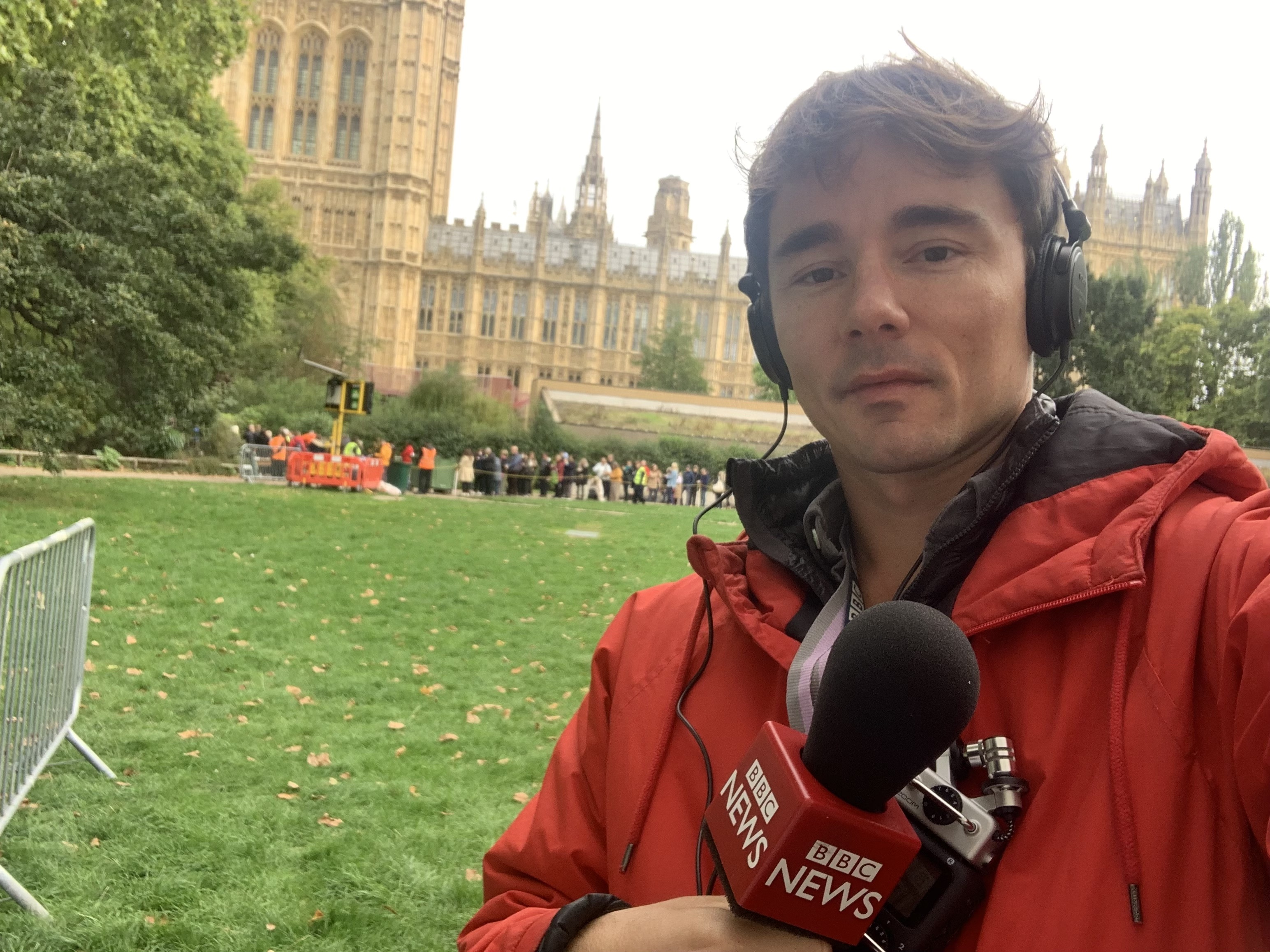 Darin Graham reporting for BBC News outside the Houses of Parliament