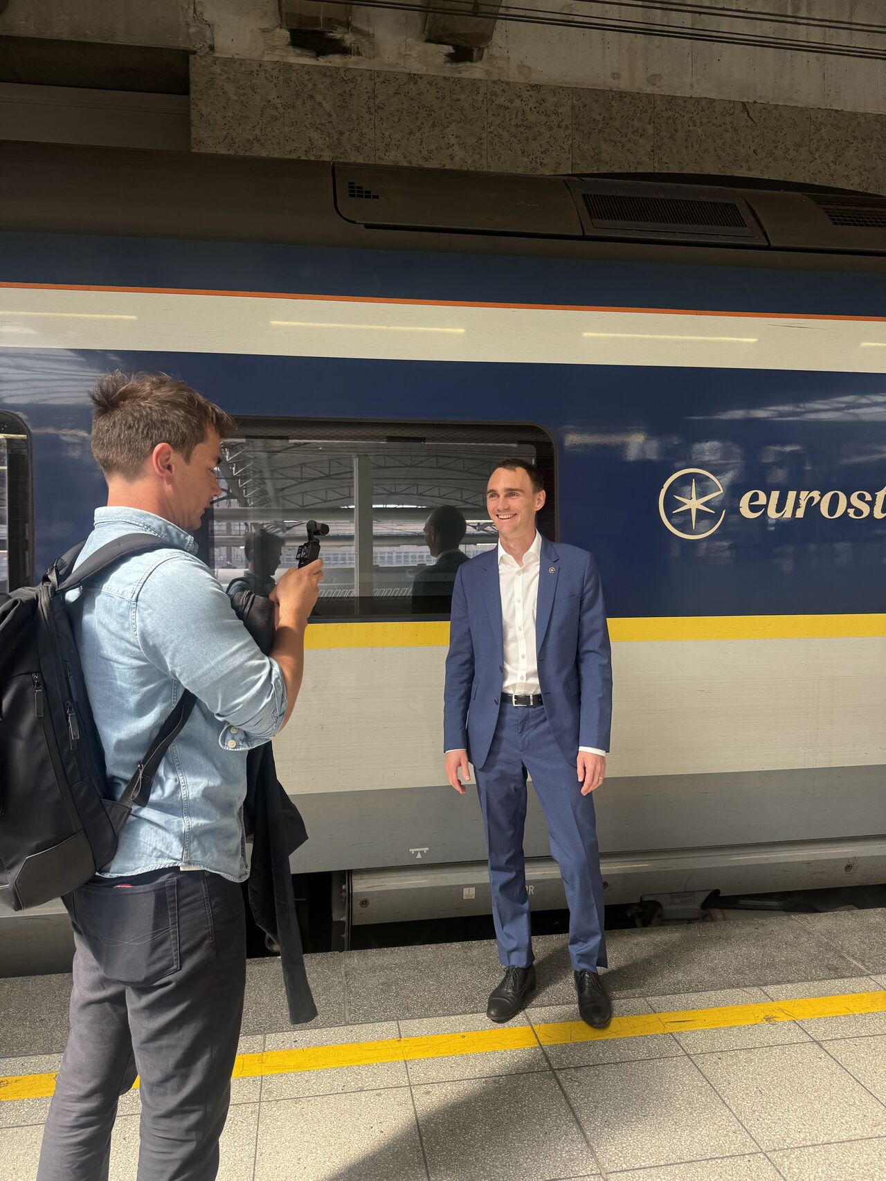 Darin Graham filming a client in front of the Eurostar